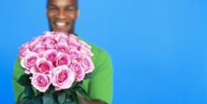 man holding bouquet of roses