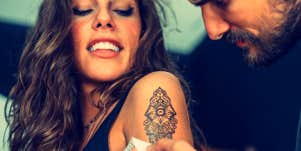 woman getting a mandala tattoo