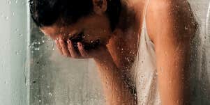 depressed wife crying in the shower
