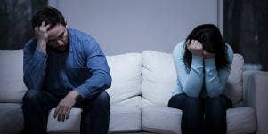 couple arguing on the couch