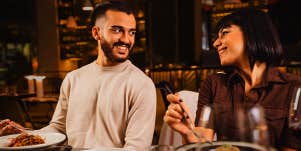 man and woman on dinner date