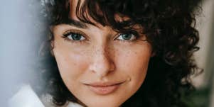 smiling woman with freckles