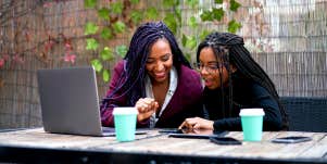 African-American Woman works with younger woman