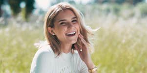 woman with mole on face smiling