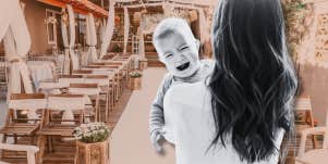 woman holding crying baby in front of wedding ceremony setup