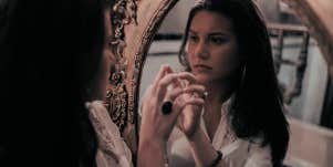 woman looking in a mirror