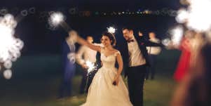 bride at wedding using sparklers