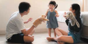three sibling kids playing together