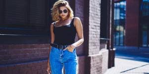 woman in sunglasses high waist jeans