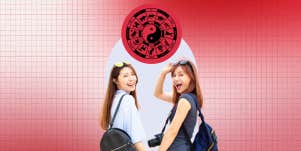 two Asian women and chinese zodiac wheel