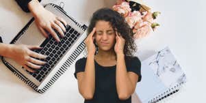 Woman stressed from multitasking 