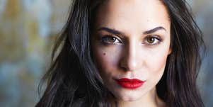 Strong woman looks at camera