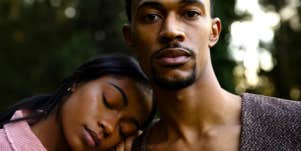 girlfriend resting her head on her boyfriend's shoulder