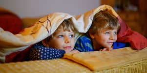 two boys watching tv