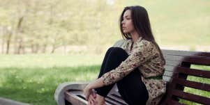 woman sitting on bench