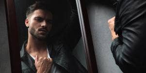 man looking in mirror