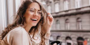 woman laughing on balcony