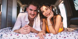 couple lying in back of van