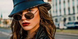 Woman in black leather hat