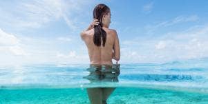 nude woman in ocean