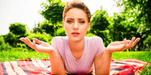 Woman on picnic blanket looks puzzled