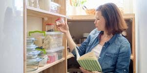 woman organizing shelf