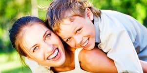 Laughing mother and child outdoors