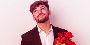 man holding flowers