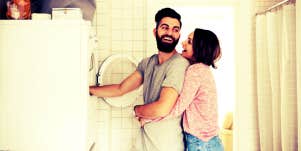 woman hugging husband for helping around the house