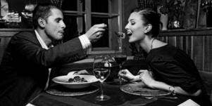 man feeding pasta