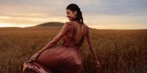 woman in flowy dress in field