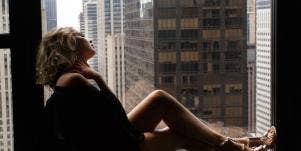 woman on window ledge