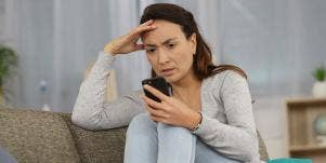 woman looking exasperated on phone