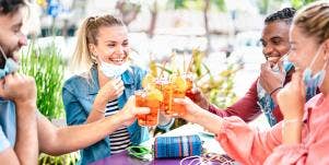friends toasting drinks outside