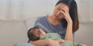overwhelmed woman with baby