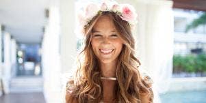 woman with flower crown smiling