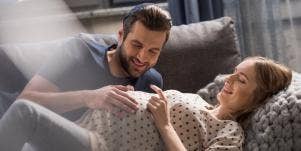 happy man and pregnant woman 