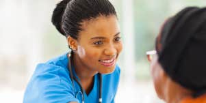 Nurse comforts elderly patient