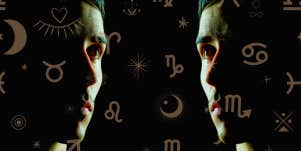 man's facial silhouette and zodiac sign glyphs