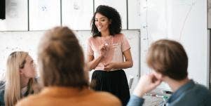 woman speaking to co-workers