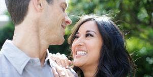 couple smiling looking into each other's eyes