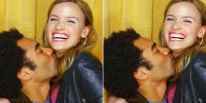 man kissing a smiling woman