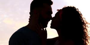 silhouette of couple in sunset