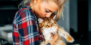 Girl loving her cat