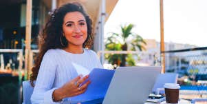 girl working at laptop outside