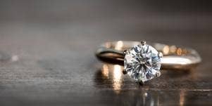 engagement ring sitting on table