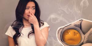 woman smelling rotten eggs