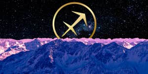sagittarius symbol and purple mountains