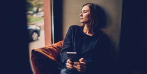woman looking out of the window