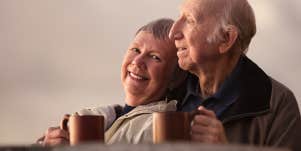 older couple embracing 